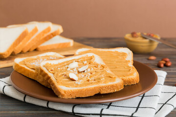 Peanut butter sandwiches or toasts on light table background.Breakfast. Vegetarian food. American cuisine top view vith copy space