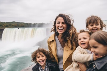 mother with children on the background of the Niagara Falls, Ontario, Canada