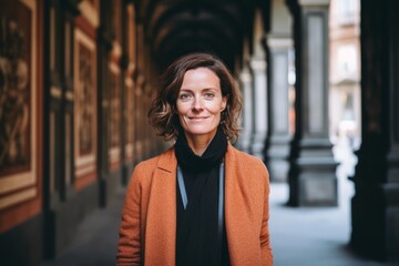 Portrait of a beautiful woman in a coat in the city.