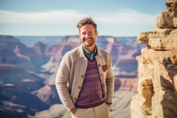 Fototapeta premium Handsome man standing in Grand Canyon National Park, Arizona, USA