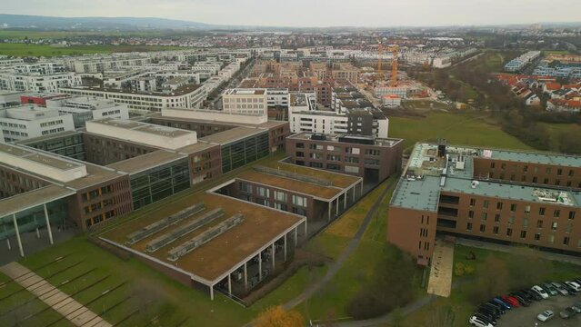 Aerial panoramic footage of buildings in urban neighbourhood. Complex of Goethe University. Frankfurt am Main, Germany