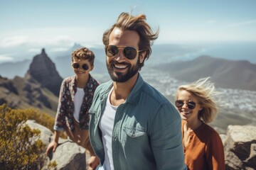 Obraz premium Lifestyle portrait photography of a satisfied man in his 30s that is with the family at the Table Mountain in Cape Town South Africa . Generative AI