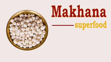 Makhana Superfood text written with fox nuts in copper plate in light background. Makhana or foxnut...
