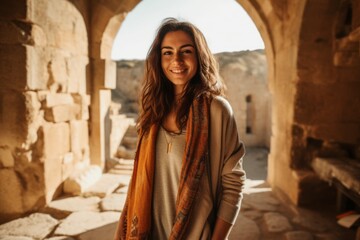 Naklejka premium Portrait of a young woman in the old city of Petra, Jordan.