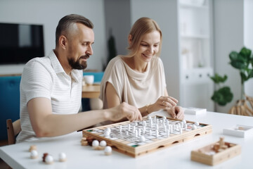Fototapeta premium A middle-aged couple is playing a board game in the living room. Photorealistic illustration generative AI.