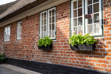 Old buildings with thatched roofs on a small island in Denmark