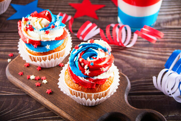 Independence Day Fourth of July USA American patriotic party with american symbols. Cupcakes dessert decorated cream cheese or buttercream.