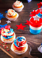 Independence Day Fourth of July USA American patriotic party with american symbols. Cupcakes dessert decorated cream cheese or buttercream.