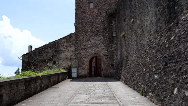 Walking pov, the entrance to the ancient medieval village of Malgrate in Lunigiana, Tuscany.