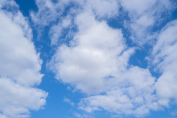 Bright blue sky with white clouds in spring
