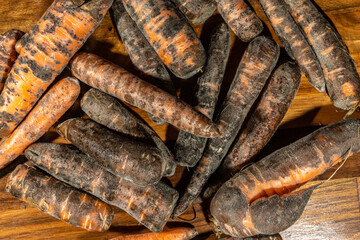 Moldy carrots. Close-up of mouldy vegetables. Food gone bad.