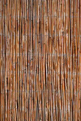 Vertical image Abstract background of reed or straw branches.