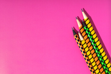 Top view of pencils on the magenta background.Concept of creativity and imagination