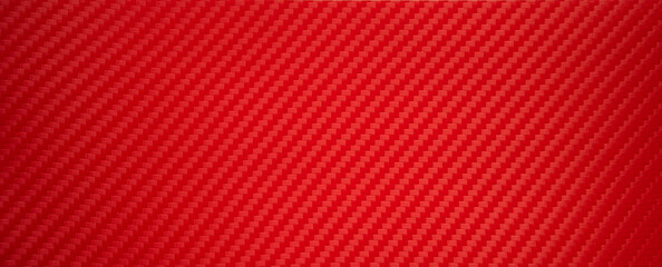 Photo of the texture of red sports carbon fiber. Rectangular background made of carbon film. Sports tuning of the car interior.