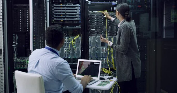 Teamwork, cable and server room, woman and man with tablet, laptop and network administration. Tech employees, system maintenance and technician team problem solving online in data center together.