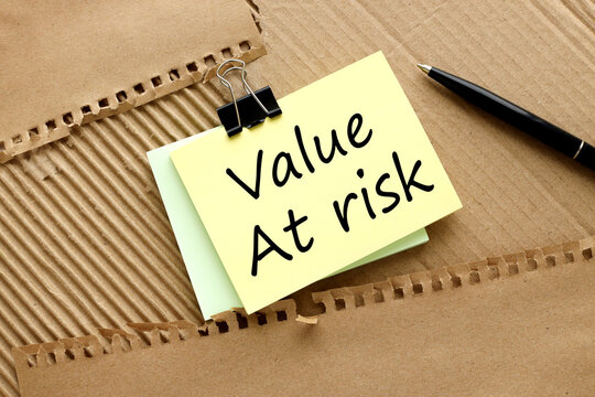Value at Risk. text on yellow sticky note on brown background. Business concept.