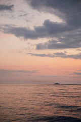 Fototapeta na wymiar beautiful sea ship in the distance at sunset nature sea voyage