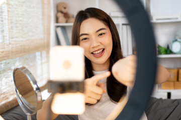 Beautiful women with social media influences are teaching makeup and use cosmetics, In front of the...