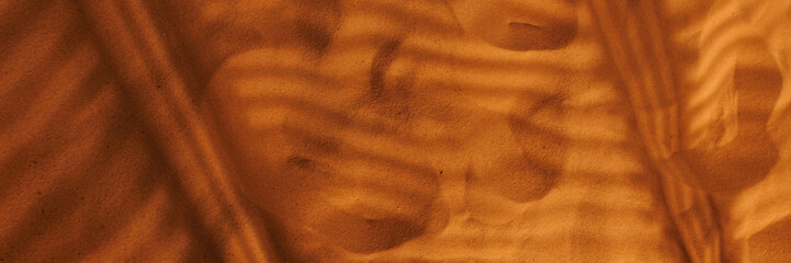 Abstract sand texture in sunset light. High quality photo. Banner for website header design with copy space.