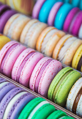 Top view of colorful macarons group. French sweet delicious bakery.  Colorful macaroons display in...