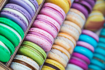 Top view of colorful macarons group. French sweet delicious bakery.  Colorful macaroons display in...