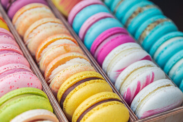 Yellow , pink, blue, orange macarons. Sweet French bakery  candy bar. Rainbow confectionary.
