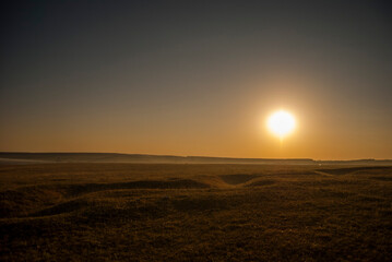 Sunset over the field.