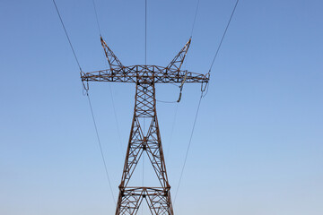 lectricity pylon against blue sky in Ukraine