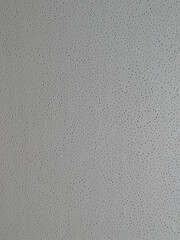 Gray background, with black dots, side view, texture