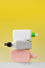 A set of cosmetic bottles on a white shelf with a place for your logo. Routine body and hair care, toiletries.