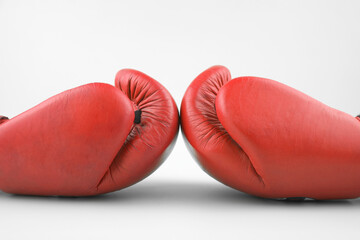 Red boxing gloves on a white background.
