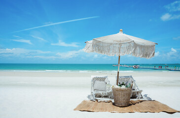 Beautiful bech. chairs and umbrella on the beach, blue sky. blue sky and ocean. vacation and resort concepts. Relax in style on a beautiful white sand beach with beach chairs and an umbrella.