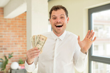 feeling happy and astonished at something unbelievable. dollar banknotes concept