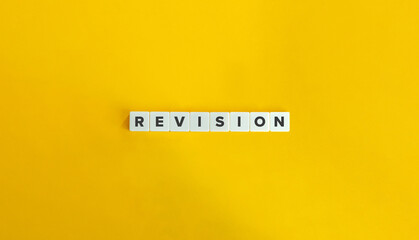 Revision Word on Letter Tiles on Yellow Background. Minimal Aesthetic.