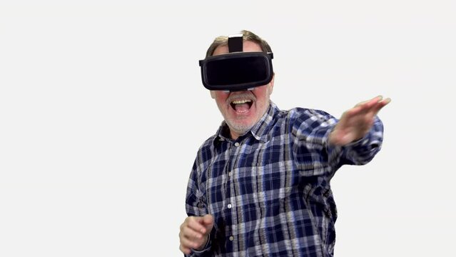 Portrait of scared senior man in vr headset. Isolated on white.