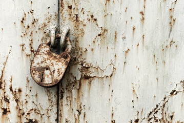 Old rusty lock on metal doors. Lock on the door with an empty place for an inscription