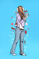 Beautiful fashionable woman in drawn clothes and with ice skates on light blue background