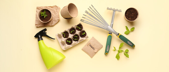 Pack with seeds, green seedlings and gardening tools on light background
