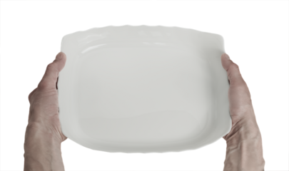 A man is holding a white glass plate in his hands
