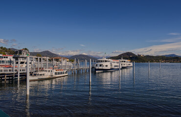 Boats for tourists docked at the port of Arona.