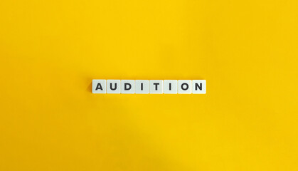 Audition Word on Letter Tiles on Yellow Background. Minimal Aesthetic.