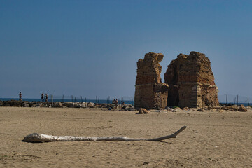 old ruin on a beach with sea in background