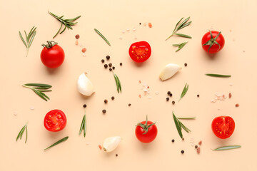 Composition with ripe cherry tomatoes and spices on beige background