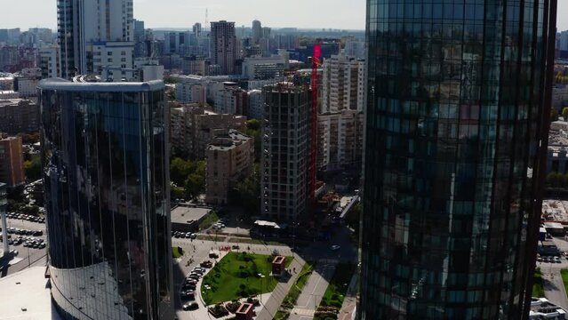 Top view of beautiful modern city on sunny summer day. Stock footage. Beautiful panorama of big city on summer day. Architecture and buildings in center of big city