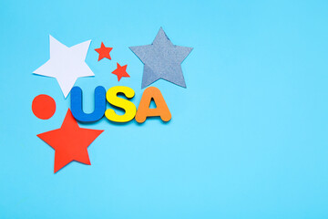 Text USA and stars on blue background. Independence Day celebration