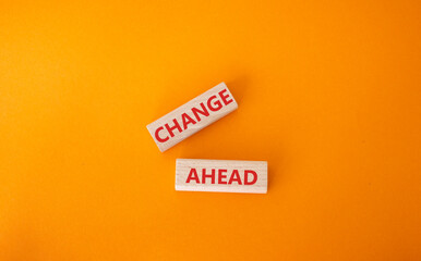 Change ahead symbol. Wooden blocks with words Change ahead. Beautiful orange background. Business and Change ahead concept. Copy space.