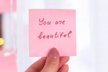 inspirational quotes on pink sticker on the mirror,handwriting text