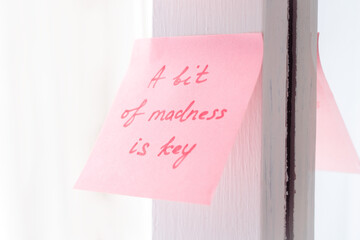 inspirational quotes on pink sticker on the mirror,handwriting text