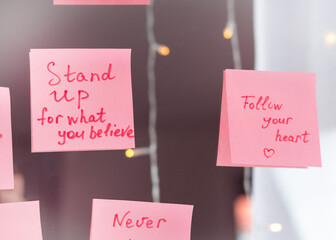 inspirational quotes on pink sticker on the mirror,handwriting text