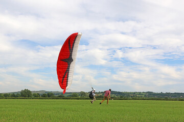 Obraz premium Paraglider launching wing in a field 